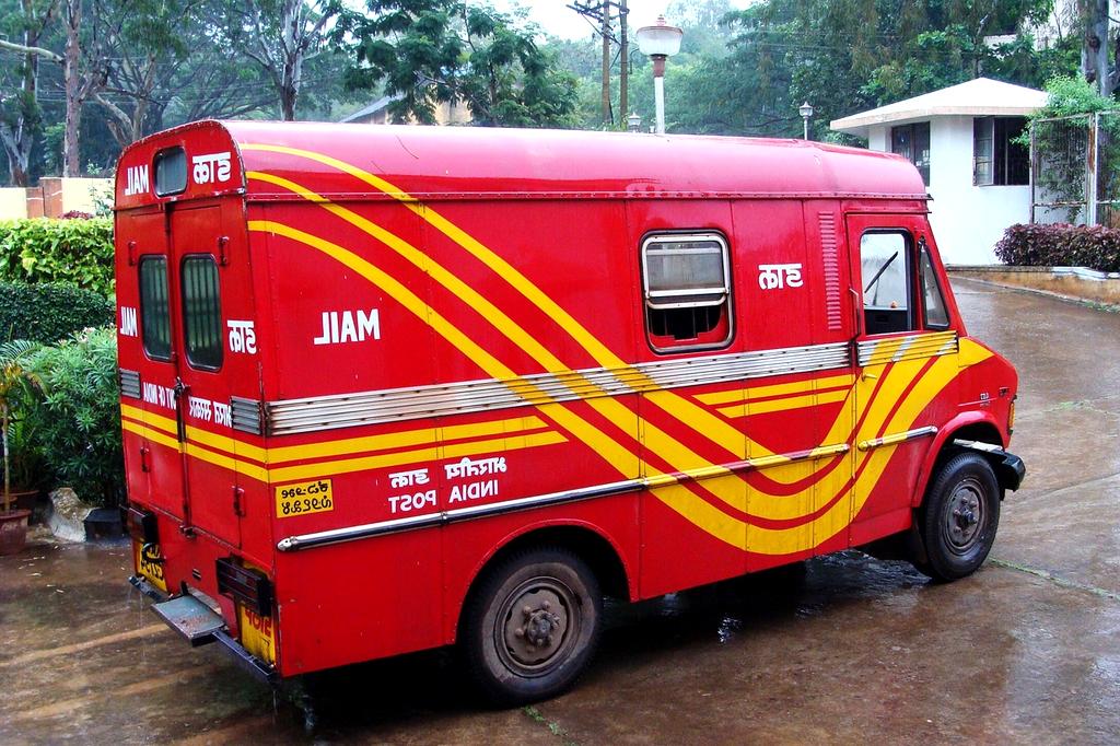 Electric delivery vans charging at a commercial depot